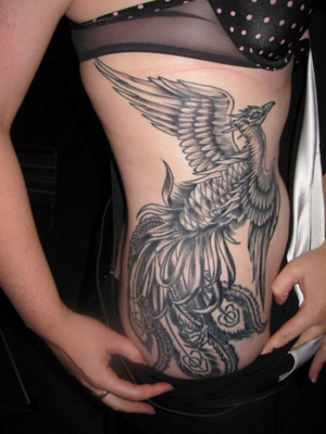 29. Amazing Black Dragon Side Tattoo