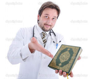 Young attractive muslim male doctor holding Holy book Qoran (no ...