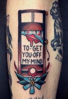 Guillotine With Quote on Calf