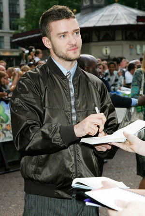 Singer and actor Justin Timberlake signs autographs for fans at the UK ...