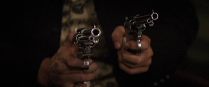 Doc Holliday ( Val Kilmer ) draws his SAA Quickdraw and Colt Lightning ...
