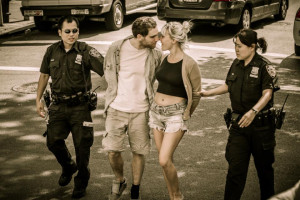 Check Out New York's Modern Day Bonnie And Clyde Kissing In Handcuffs