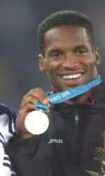 Ato Boldon displays his silver medal in the 100m final at the 2000 ...