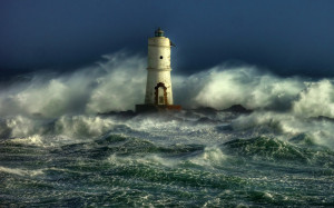 Old lighthouse standing in storm