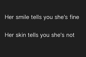 Her smile tells you she's fine. Her skin tells you she's not
