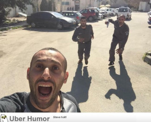 Palestinian man taking selfie while Israeli police chase him