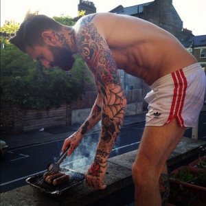 Tattoo. Hipster. Beard. Shorts.