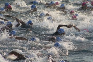 . Triathlon is work that can leave you crumpled in a heap, puking ...