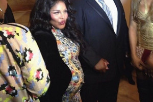 Lil Kim Shows Her Baby Bump at NYFW