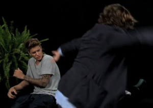 VIDEO Zach Galifianakis spanks Justin Bieber with a belt