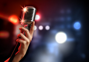 Female Hand Holding Microphone