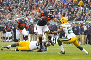 Brandon Marshallbreaks a tackle by Green Bay Packers cornerback Casey ...
