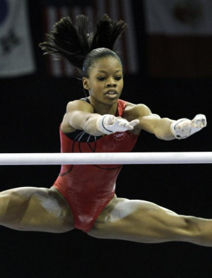 gymnast Gabrielle Douglas practices on the uneven bars on ...