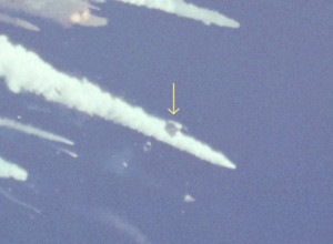 Arrow points to intact flight-cabin during Challenger disaster.