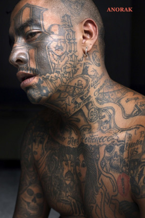Mara gang member who identifies himself as “Smoking,” 25, poses ...