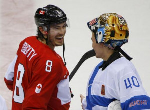 Canada's Drew Doughty laughs with Finland's goalie Tuukka Rask after ...