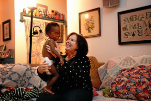 Single mom and nurse Cynthia Bradbury plays with her son Xander, 2 ...