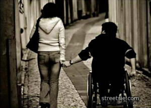 quadriplegic wheelchair love couple holding hands