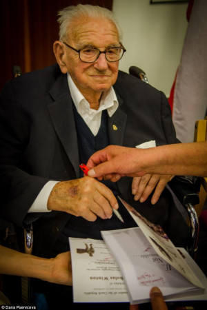 Sir Nicholas Winton signing a copy of a new book about his life called ...