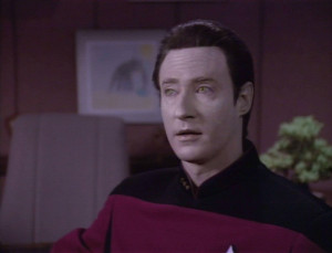 Why is Data's uniform gold and not red?