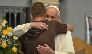 Pope_Francis_hugs_a_man_in_his_visit_to_a_rehab_hospital.jpg