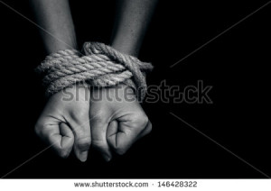 Hands of a missing kidnapped, abused, hostage, victim woman tied up ...