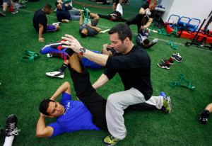 Ruben Tejada received help stretching from the conditioning coach Mike ...