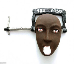 mask features the words TBI (traumatic brain injury) and PTSD (post ...