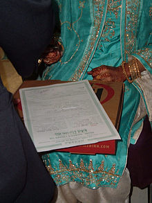 bride signing the marriage contract, Nikaah at a Pakistani wedding