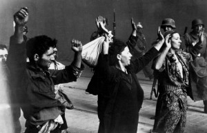 Jewish resistance fighters surrender during the Warsaw Ghetto Uprising ...