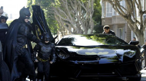 left, exits the Batmobile with Batman to save a damsel in distress ...