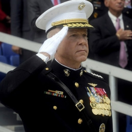 The Commandant of the Marine Corps, General James F. Amos saluting