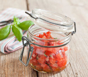 Canning Jar With Freshly Chopped Tomatoes From The Garden