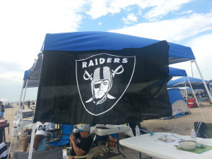 raiders flag making its first appearance at a raiders event