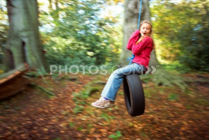 Girl Sitting On Tire Swing | Royalty-Free Images | Photos.com
