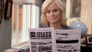 Leslie Knope and one of Ron Swanson’s redacted docs.