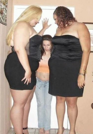of a small girl and a couple of very large girls. Those two big girls ...