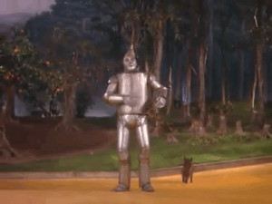 The steam shooting from the Tin Man’s cap startles Toto, who runs ...