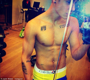 Tattoo fanatic! Justin also has Roman numerals for 4, 1, 75 - his ...