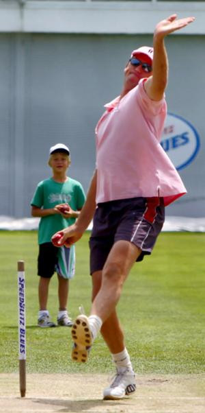 ... on, Glenn McGrath sends down a delivery in the SCG nets yesterday