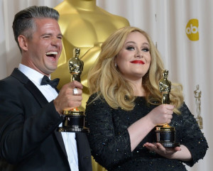 Adele Adkins and and Paul Epworth hold the Best Original Song Award ...