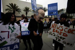 News Corp. CEO Rupert Murdoch is seen with protestors in front of Fox ...