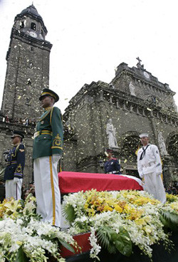 Confetti rains as the casket of former President Corazon Aquino leaves ...
