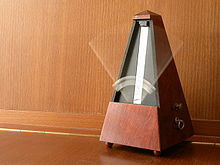 mechanical wind-up metronome in motion