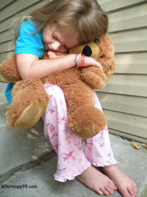 Very sad baby girl with teddy