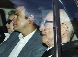 ... Murdoch and his eldest son, Lachlan, leave his London home. Photo: AP