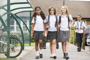 Junior school children leaving school - Stock Image