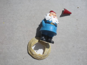 Here are the two gnomes. front view The broken gnome is precariously ...