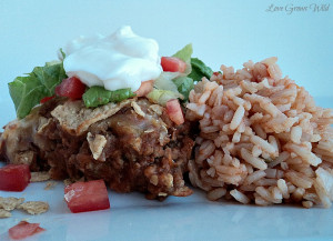 This Taco Casserole next to a good helping of Mexican Rice (recipe to ...