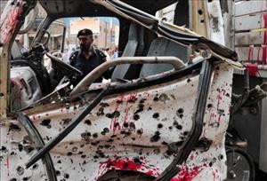 ... of a police van following a bomb explosion in Peshawar. (Getty Images